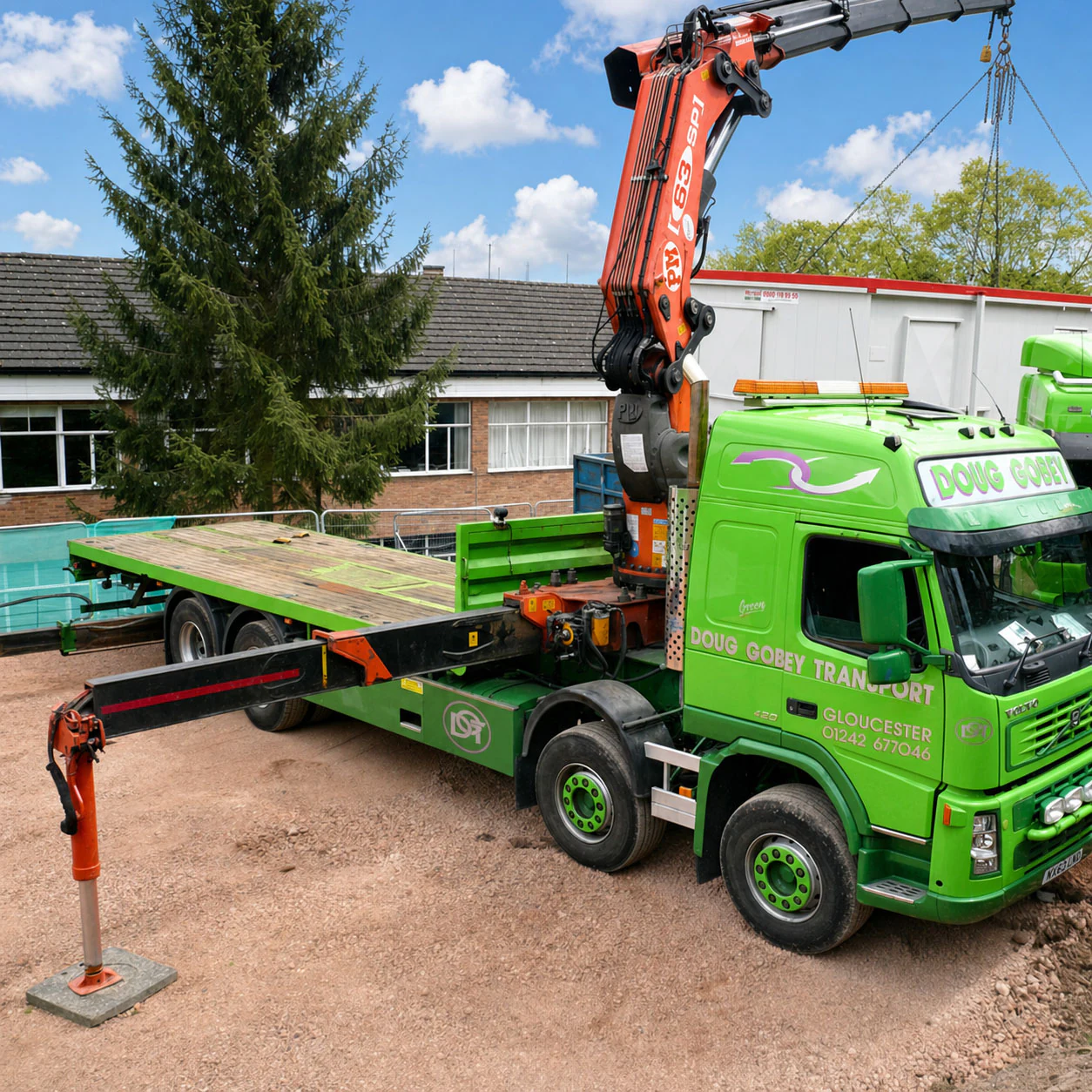 Doug Gobey crane lorry with outriggers deployed, offloading a flatbed trailer